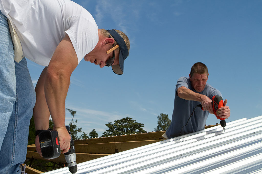 Help Your Air Conditioner Out This Summer By Improving Your Roof